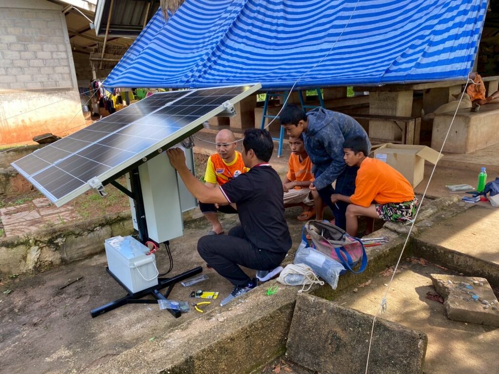 Children were interested in the installation work and kindly helped our engineers.