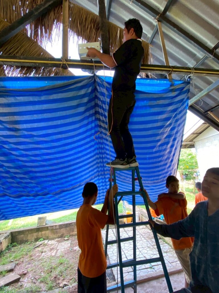 Children were interested in the installation work and kindly helped our engineers.